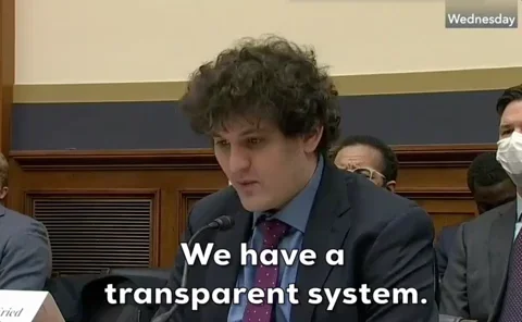 Sam Bankman-Fried (SBF) testifying before US Congress, subtitle text 'We have a transparent system.', ironic given FTX collapse