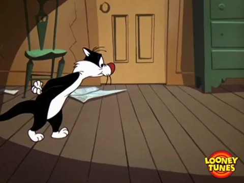 Sylvestre (Looney Tunes) marche prudemment sur la pointe des pieds