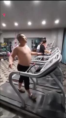 Person struggling on treadmill, drenched in effort