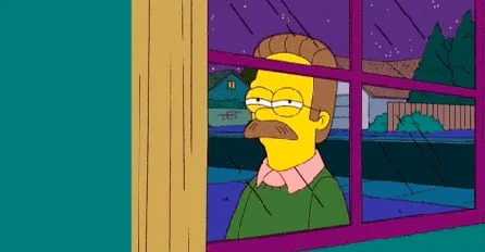 Ned Flanders (Simpsons) regarde par la fenêtre, l'air triste/nostalgique
