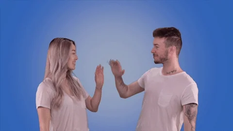 Couple se tape un high-five — collaboration, accord