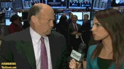 Jim Cramer being interviewed on the NYSE trading floor, financial screens behind him, TheStreet.com logo visible, live financial news scene