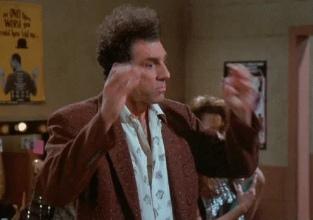 Kramer (Seinfeld) danse/gesticule au bar — excitation, énergie