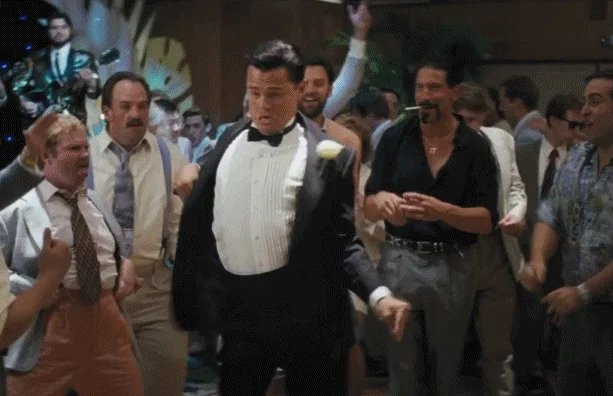 Leonardo DiCaprio dancing joyfully, celebrating, Wolf of Wall Street happy dance scene