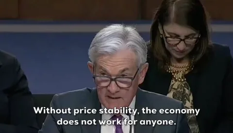 Jerome Powell testifying before Congress, subtitle 'Without price stability, the economy does not work for anyone.', serious tone, official Fed hearing