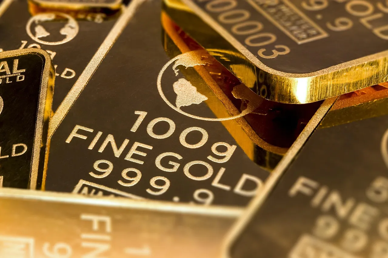 A close-up shot of several gold bars, highlighting their weight and purity.