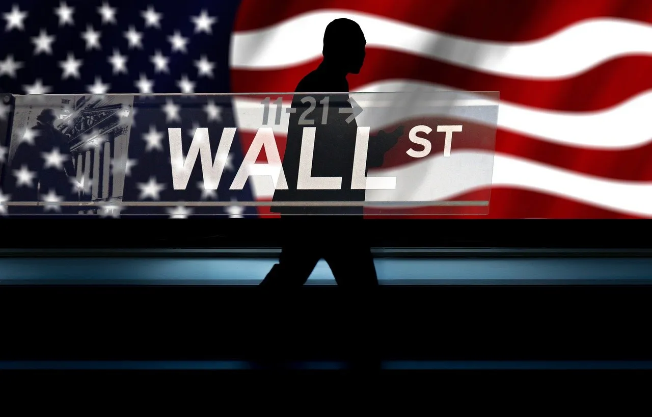 A silhouette of a person walks in front of an American flag with "WALL ST" overlaid.